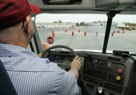 driver behind wheel of truck